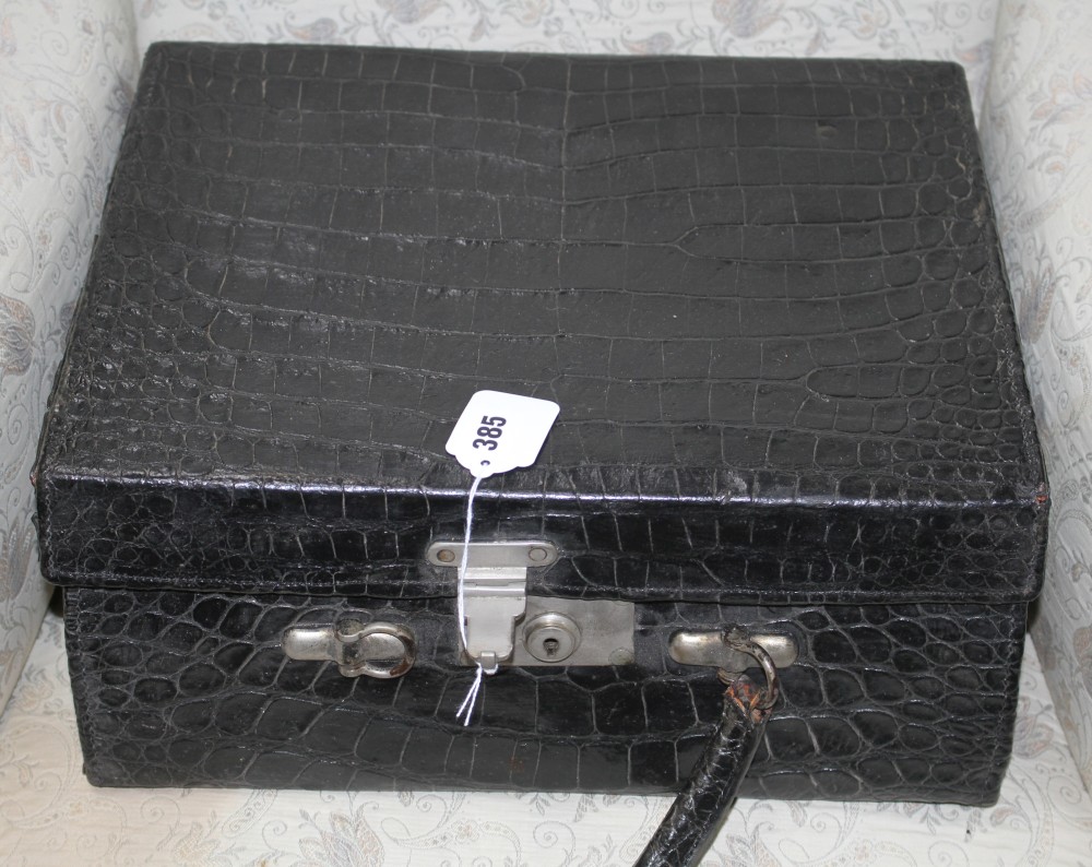 An early 20th century black crocodile toilet case, 40 x 33 x 18cm